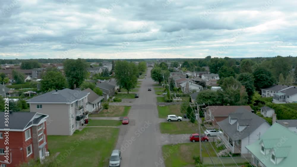 Drone descending quickly from the air to the street level in residential Saint-Charles-Borromée, Québec, Canada Drone descending quickly from the air to the street level in residential Saint-Charles-Borromée, Québec, Canada