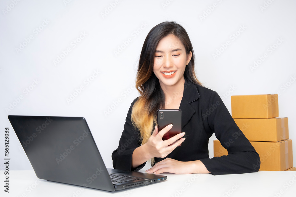 A young Asian businessman is working in the office and he also works freelance online through SEM. A young Asian businessman is working in the office and he also works freelance online through SEM.