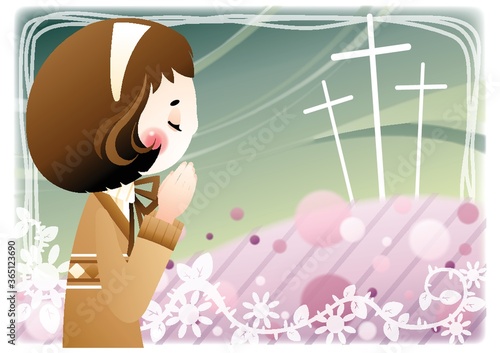 woman praying at the cemetery