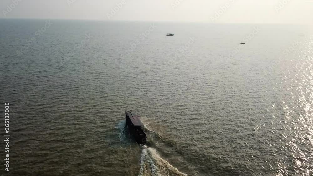 Asian Speedboat on Tonle Sap Lake, Kampong Phluk in Cambodia - Aerial Drone Asian Speedboat on Tonle Sap Lake, Kampong Phluk in Cambodia - Aerial Drone