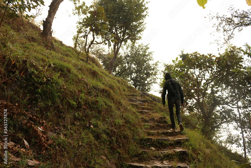 man walking on a hills