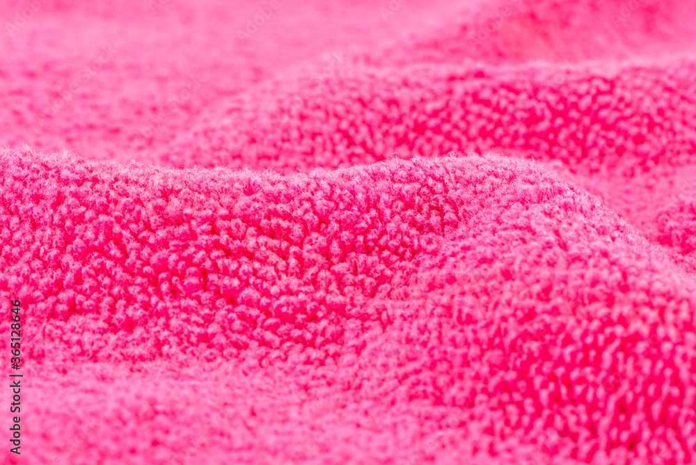 Background made of pink microfiber fabric, selective focus. Background made of pink microfiber fabric, selective focus.