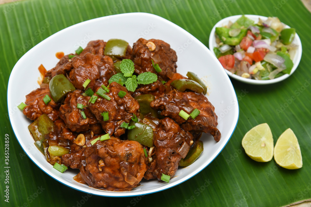 Chicken manchurian,  sweet chilli chicken, red hot and spicy curry Mumbai, Delhi India. Popular North Indian side dish for chapati, roti, naan, paratha, fried rice, pulao. Indo Chinese cuisine. 