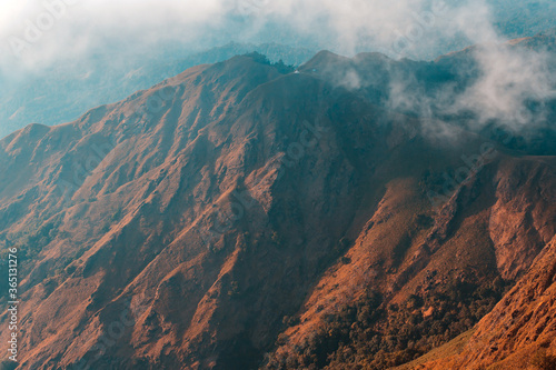 Top View Mulayit Taung golden light of the morning sun and the mist covered on Mount Mulayit,Myanmar