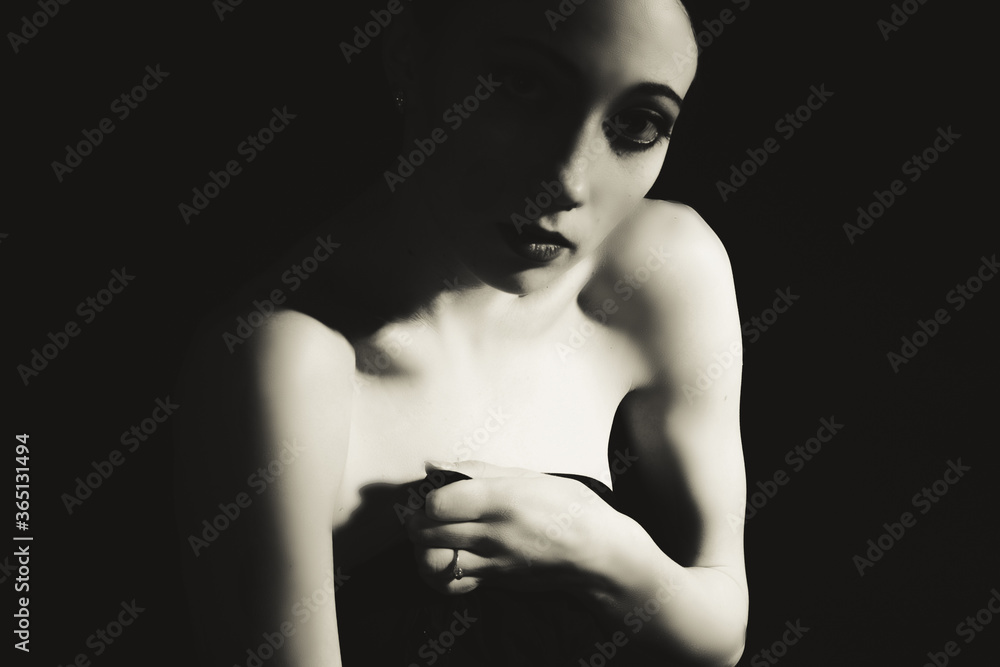 contrasting dramatic black and white portrait of a young woman contrasting dramatic black and white portrait of a young woman