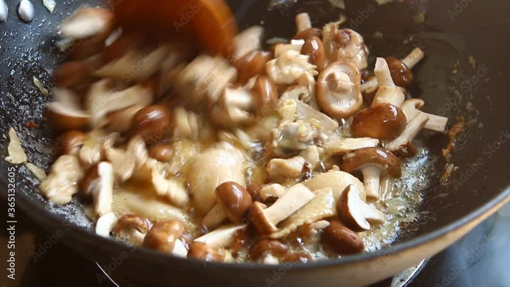 Frying chicken with shiitake mushroom in pan, in door Chiangmai Thailand Frying chicken with shiitake mushroom in pan, in door Chiangmai Thailand