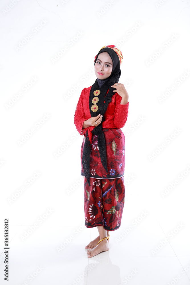Beautiful smiling Asian girl wearing a set of modern traditional clothes, the traditional female outfits originated from Indonesia. Indonesian Women isolatedd white background Beautiful smiling Asian girl wearing a set of modern traditional clothes, the traditional female outfits originated from Indonesia. Indonesian Women isolatedd white background