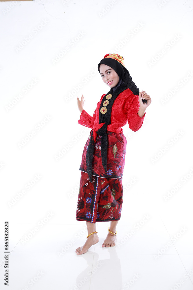 Beautiful smiling Asian girl wearing a set of modern traditional clothes, the traditional female outfits originated from Indonesia. Indonesian Women isolatedd white background