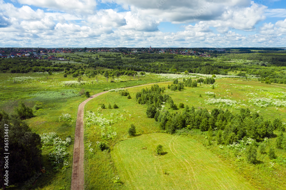 Aerial view of a country road through fields and woods Aerial view of a country road through fields and woods