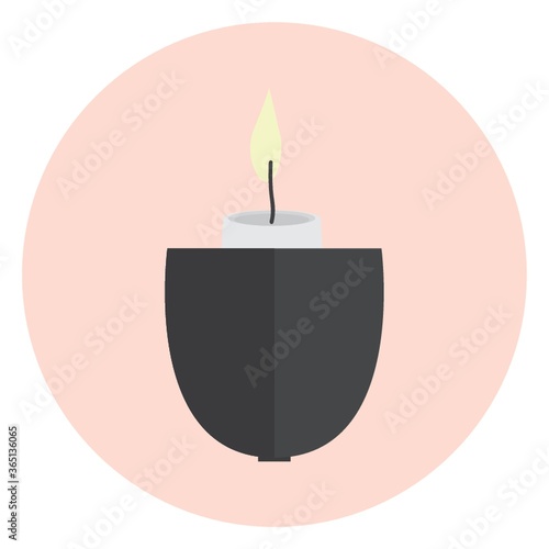 burning candle in holder