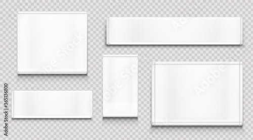 White fabric tags different shapes isolated on transparent background. Vector realistic mockup of blank cloth labels with stitches, cotton badge for textile, woven fashion sticker