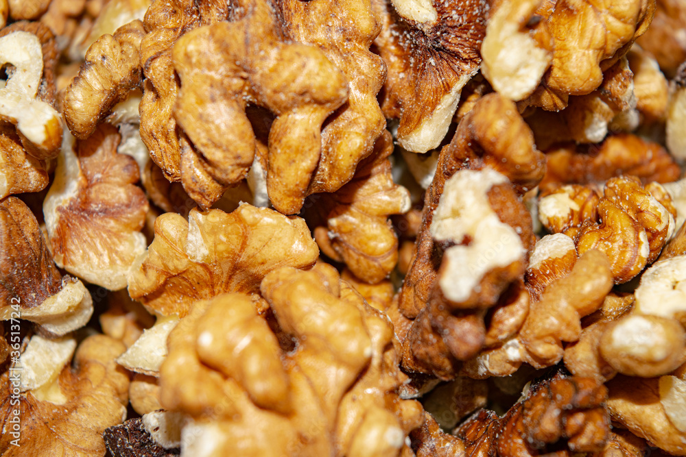 Peeled walnuts close-up. Surface texture. Healthy diet. Peeled walnuts close-up. Surface texture. Healthy diet.