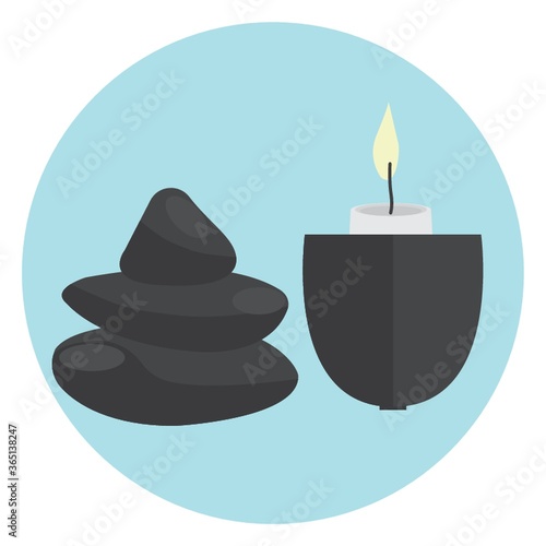 burning candle in holder and stones
