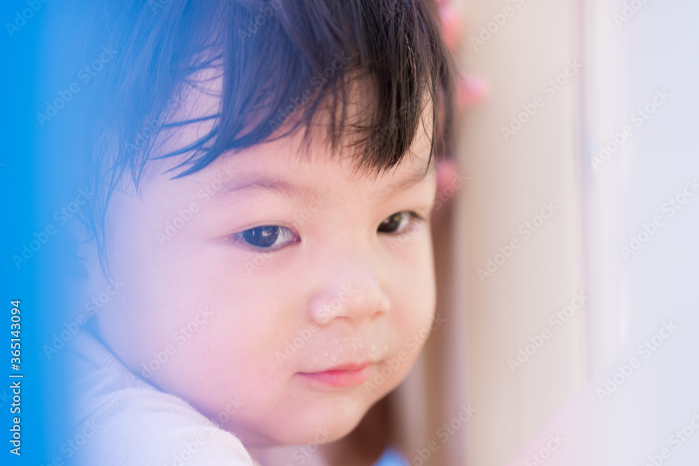 Selective focus. Head shot the little child boy played the playground until hot, sweating. Asian kid smile happy. Children 2 years old. Selective focus. Head shot the little child boy played the playground until hot, sweating. Asian kid smile happy. Children 2 years old.