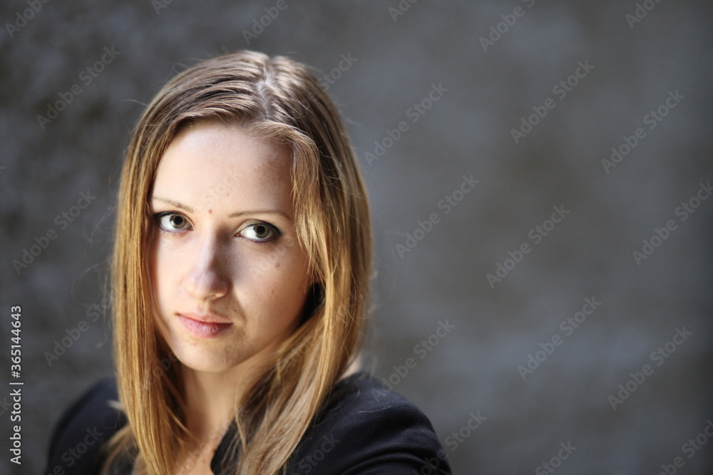Beautiful young girl in the concrete building at night Beautiful young girl in the concrete building at night