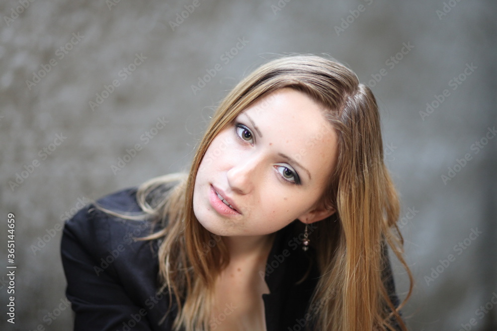Beautiful young girl in the concrete building at night Beautiful young girl in the concrete building at night