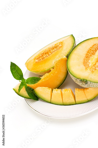 cantaloupe melon slices isolated on white background