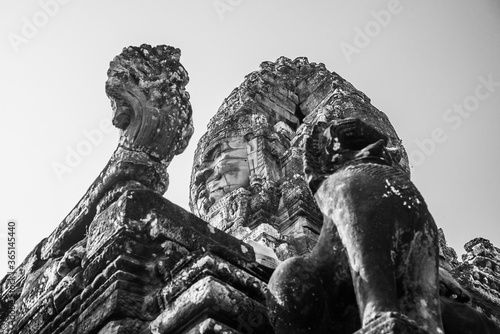 Towers of a prasat with the face of lokeshvara, with the facial features of Jayavarman VII in the archaeological place of the bayon in siam reap, cambodia
 photo