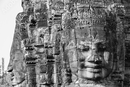 Towers of a prasat with the face of lokeshvara, with the facial features of Jayavarman VII in the archaeological place of the bayon in siam reap, cambodia
 photo