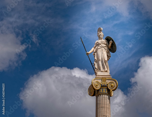 Athena, the ancient Greek goddess of wisdom and knowledge under impressive sky, Athens Greece