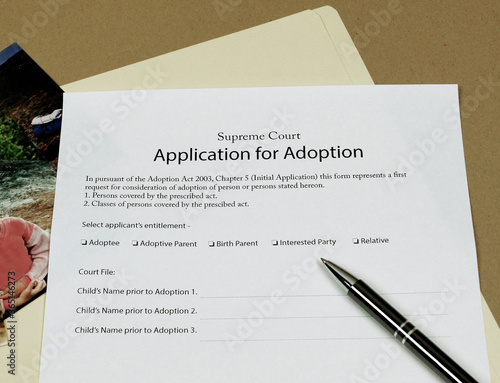 Application For Adoption papers ready to be completed and signed.