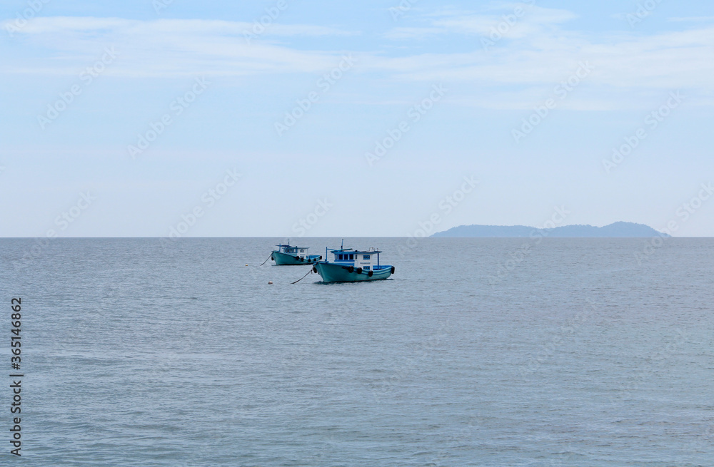 Boats floating in the sea, Tioman Island