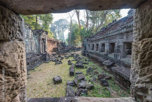 Towers of a prasat with the face of lokeshvara, with the facial features of Jayavarman VII in the archaeological place of the bayon in siam reap, cambodia photo