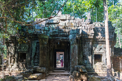 Towers of a prasat with the face of lokeshvara, with the facial features of Jayavarman VII in the archaeological place of the bayon in siam reap, cambodia photo