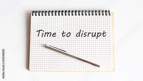 Concept TIME TO DISRUPT message on notebook on white background