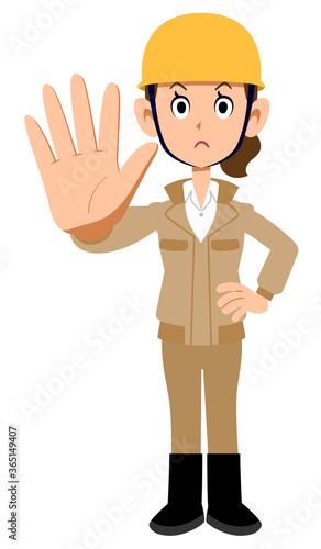 制止するヘルメットを被った作業着の女性
