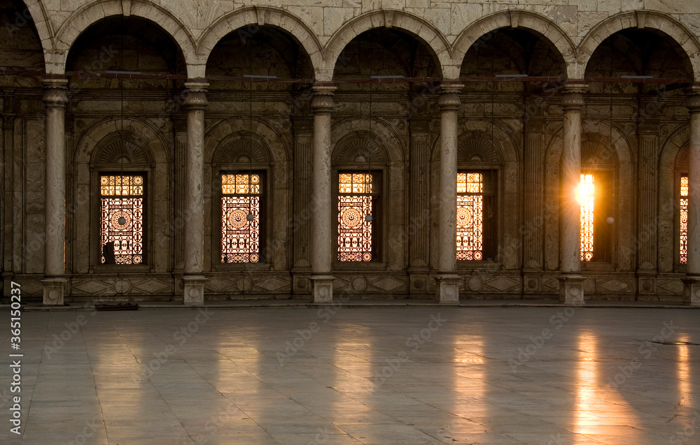 Front angle of old, historical Islamic building with beautiful sun rays entering through window.