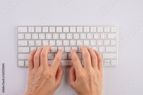 Close-up of typing female hand on keyboard