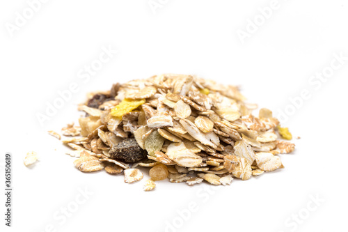 oatmeal with raisins, coconut, pineapple and banana slices isolated on a white background. For packing oatmeal or granola.