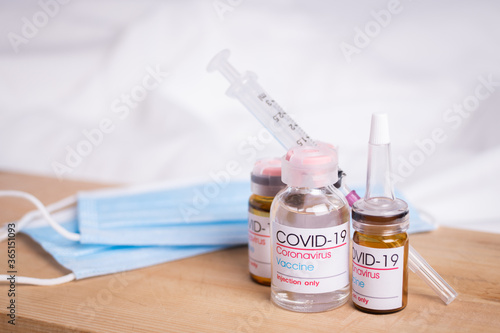 Bottle of coronavirus vaccine on table. Coronavirus vaccine COVID-19. 2019. 