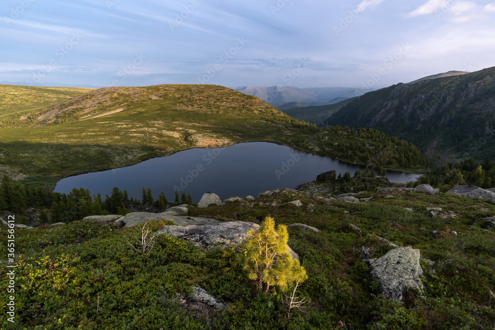 Naklejka premium Lake at Pass Rassokha in Khamar-Daban mountains
