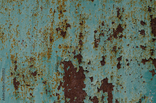 Rusty metal. Old cracked paint.