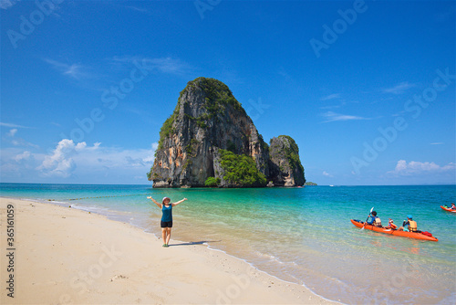 photo taken on a wide angle lens, girl on the shore of the azure sea in Thailand, the transparent sea, a picturesque island, paradise pleasure, travel and vacation © Aleksandr Lavrinenko