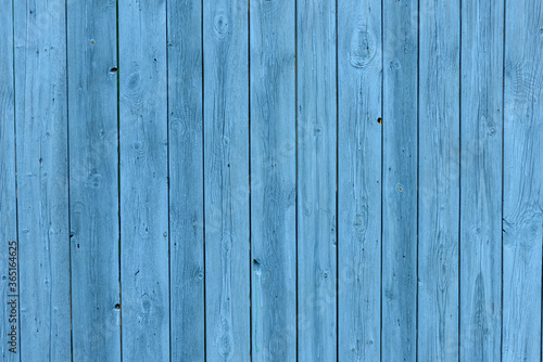 Blue wooden background  old age effect. Old boards painted light blue  close-up.