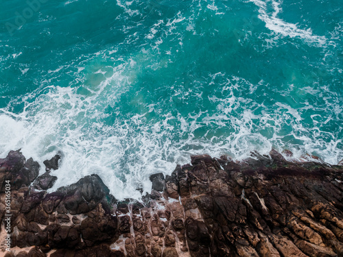 View from above, rocky coast, turquoise sea.