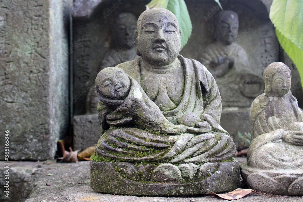 Statue of Buddha and Jizo at a Japanese temple