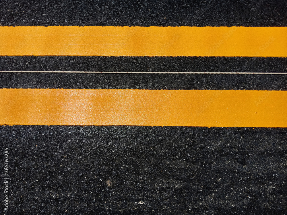 Fototapeta premium Yellow traffic line color For the safety of traveling