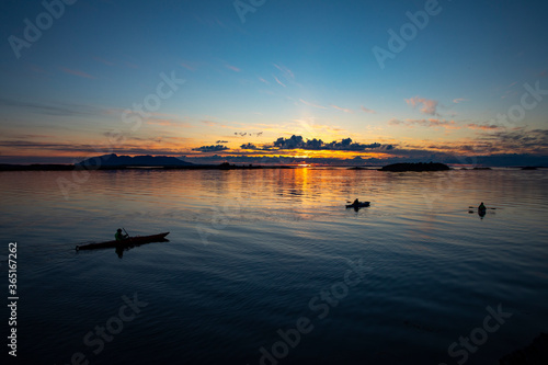 Kayaking in Midnight Sun on Helgeland in Northern Norway photo