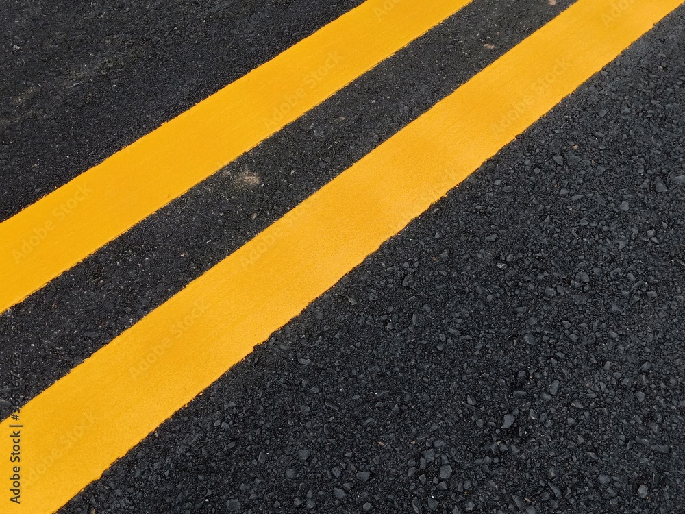 Fototapeta premium Yellow traffic line color For the safety of traveling