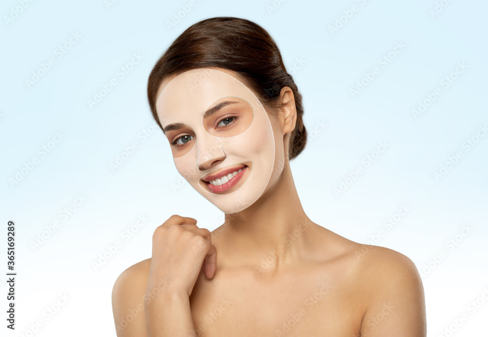 beauty, skin hydration and people concept - happy smiling young woman with hydrogel mask on face over blue background beauty, skin hydration and people concept - happy smiling young woman with hydrogel mask on face over blue background