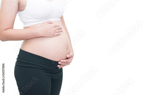 pregnancy with her hand on white background © somkanokwan