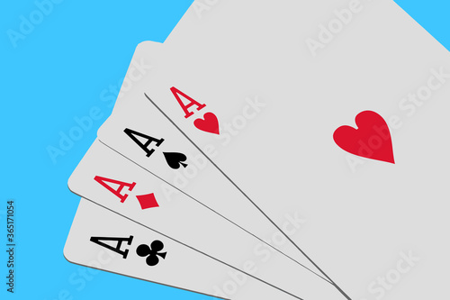 Four aces playing cards on blue background