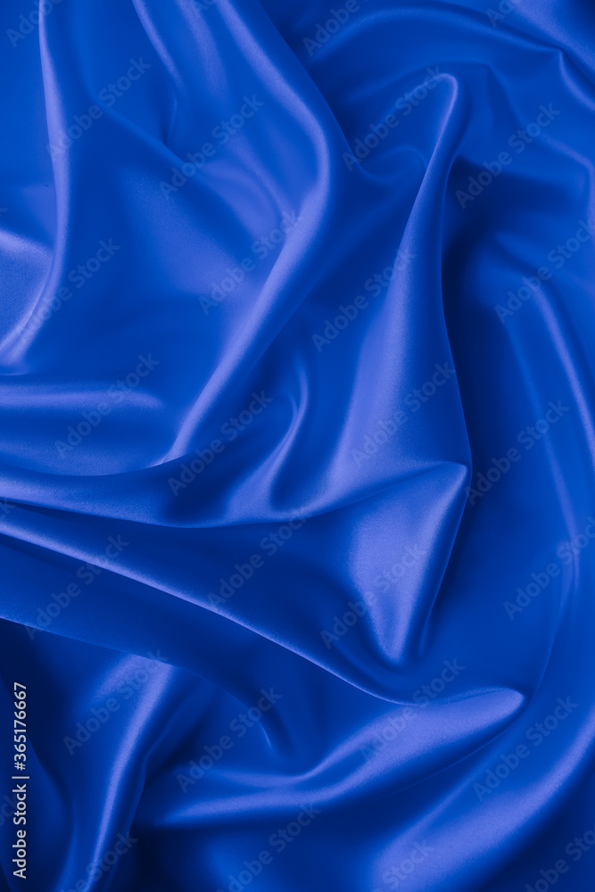 Beautiful elegant wavy classic blue satin silk luxury cloth fabric texture, abstract background design. Beautiful elegant wavy classic blue satin silk luxury cloth fabric texture, abstract background design.