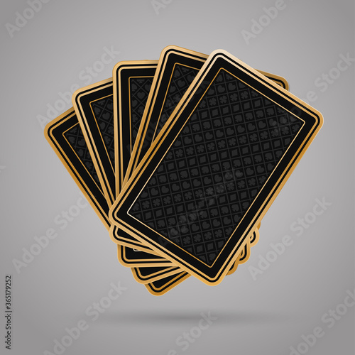 Five closed poker playing cards on grey background. Black and golden back side design