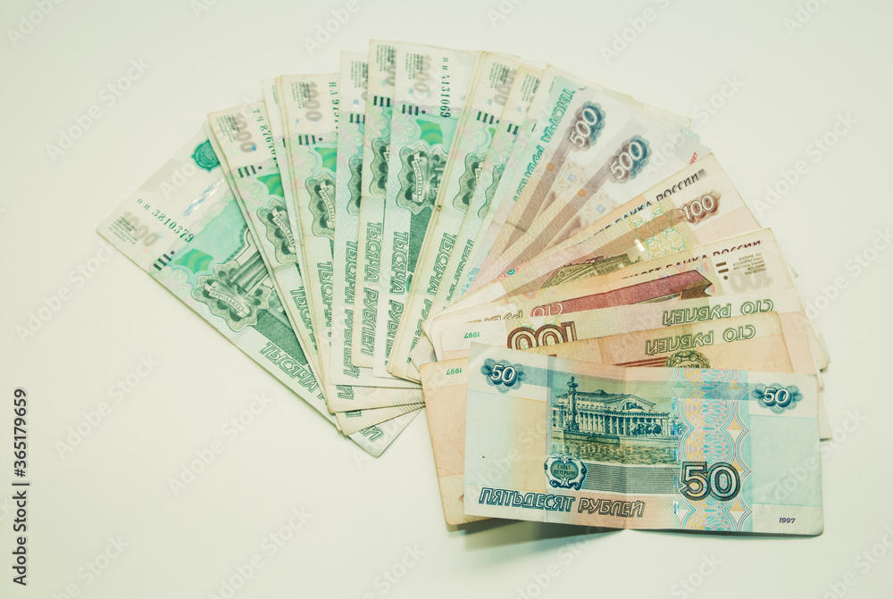 Money notes of one thousand, five hundred, one hundred and fifty rubles are on a white background Money notes of one thousand, five hundred, one hundred and fifty rubles are on a white background