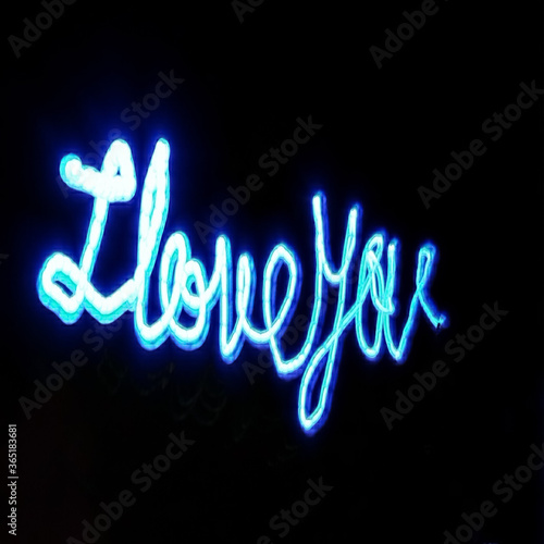 Light painting 3d design. Combination of sky blue and white light against a black background 